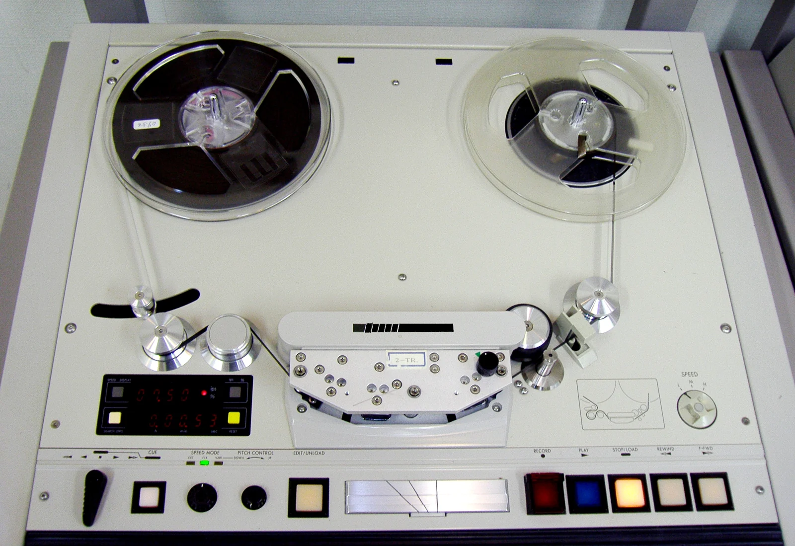 Close view of reels and the tape path of an Otari open-reel audio recorder.